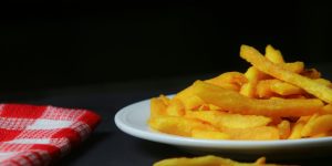 a plate of french fries on a table
