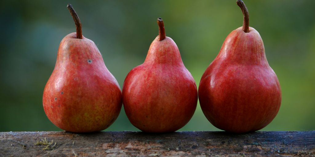 three red pear fruits