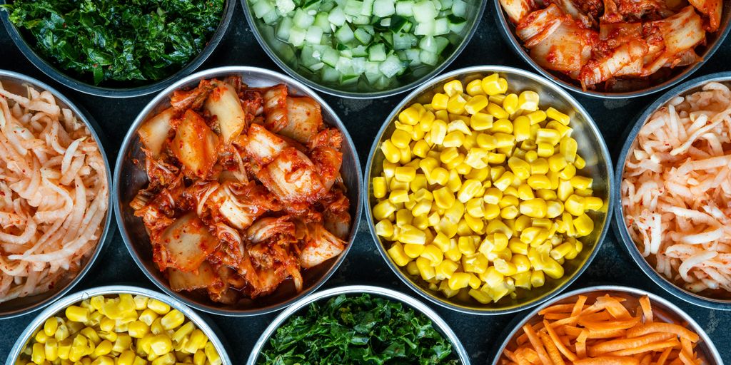 a bunch of bowls filled with different types of food